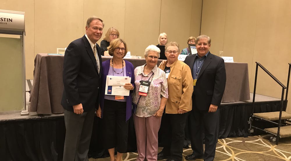 Rob Grim and Joe Maiale of InSinkErator present the First Place service proejct award to Gail McWilliams, Becky Davis and Bev Potts of the Illinois PHCC Auxiliary.