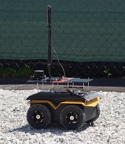 An autonomous rover developed by the University of Illinois maps the simulated worksite.