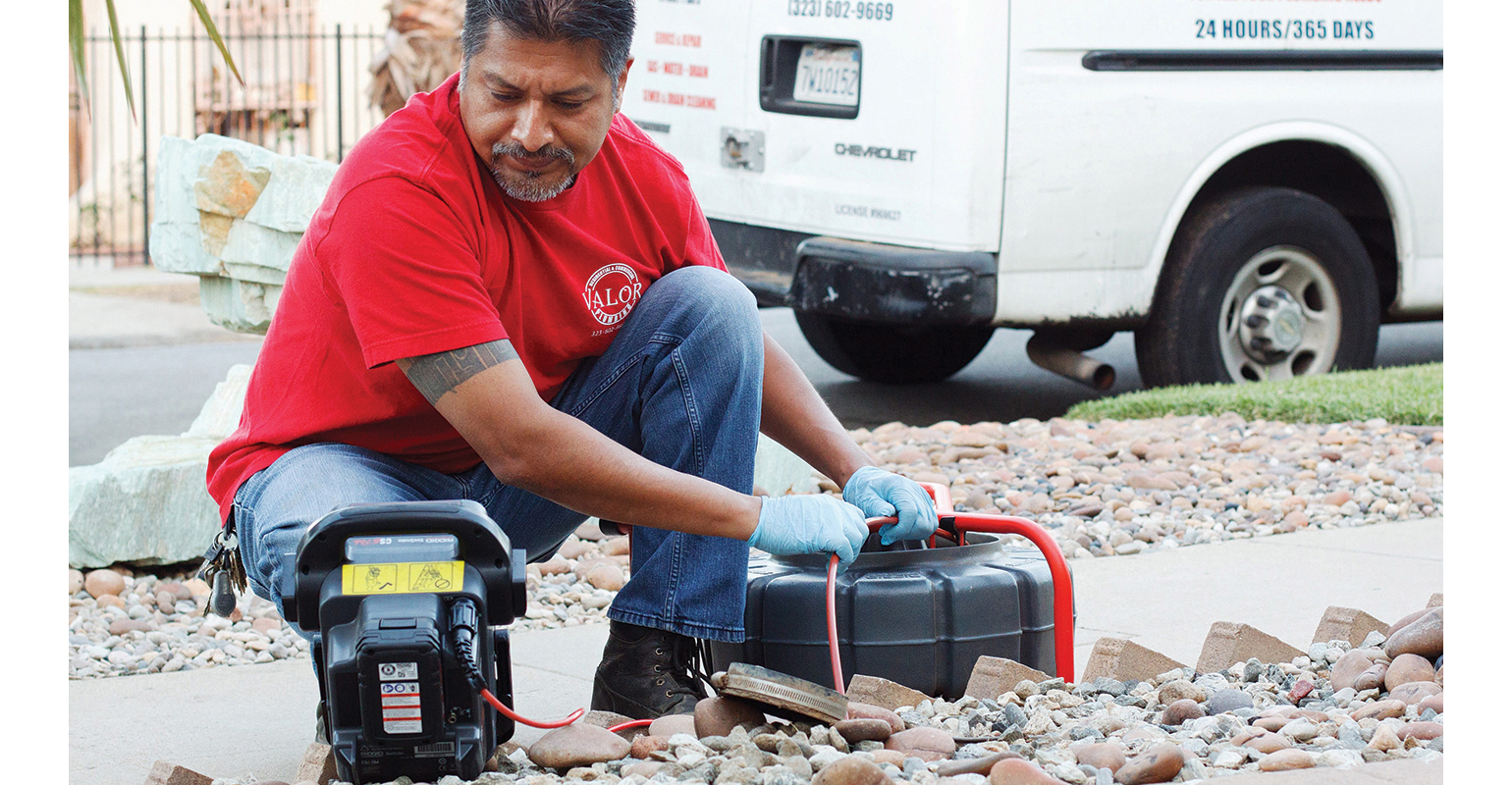 Henry Sanches performs a video drain inspection for a customer.