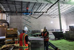 Technicians working at a six- to eight-foot distance. Technicians working at a six- to eight-foot distance.