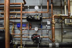 The other is the wall piping, controls and pump: The cogeneration system at FLCC produces domestic hot water and electricity, as well as space heating for the nearly 500,000 square feet of campus buildings.
