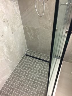 The Hospitality Innovations crew installed 225 walk-in showers with linear drainage systems in the Houston Marriott Medical Center Hotel at about 10 per day. The Hospitality Innovations crew installed 225 walk-in showers with linear drainage systems in the Houston Marriott Medical Center Hotel at about 10 per day.