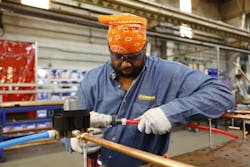 Making connections with expansion fittings during an installation at the Lumen Playhouse in Cleveland. Making connections with expansion fittings during an installation at the Lumen Playhouse in Cleveland.