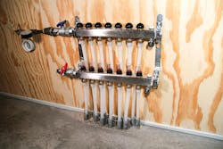 One of seven stainless steel manifolds controlling a total of 27 heating circuits throughout the Johnson Residence.