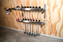 One of seven stainless steel manifolds controlling a total of 27 heating circuits throughout the Johnson Residence. One of seven stainless steel manifolds controlling a total of 27 heating circuits throughout the Johnson Residence.