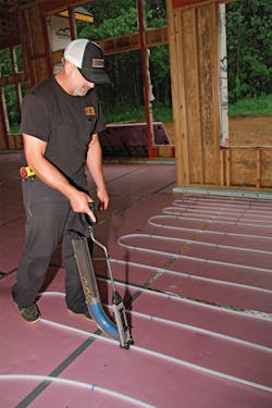 Justin Johnson used a Uponor PEX Foam Stapler to manually set the loops and secure them in place, speeding up the installation process. Justin Johnson used a Uponor PEX Foam Stapler to manually set the loops and secure them in place, speeding up the installation process.