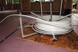 Wirsbo hePEX tubing coming off the reel for the radiant heating system. Wirsbo hePEX tubing coming off the reel for the radiant heating system.