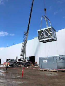 A crane moving components for the Rosina cooling tower. A crane moving components for the Rosina cooling tower.