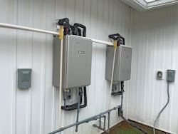 Two of the Noritz tankless units installed at Camp Cole. “During the hotter months, kids will inevitably shower more,” explains Camp Cole executive director Kelsey Carter. “The system needed to be able to keep up with demand, while also creating a safe environment for the campers. Noritz and tankless water heaters were the obvious choice.” Two of the Noritz tankless units installed at Camp Cole. “During the hotter months, kids will inevitably shower more,” explains Camp Cole executive director Kelsey Carter. “The system needed to be able to keep up with demand, while also creating a safe environment for the campers. Noritz and tankless water heaters were the obvious choice.”