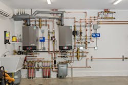 Wall-hung boilers from Lochinvar saved space in the mechanical room. Wall-hung boilers from Lochinvar saved space in the mechanical room.