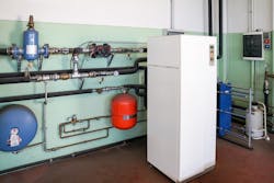 Geothermal heat pump in a mechanical room. Geothermal heat pump in a mechanical room.