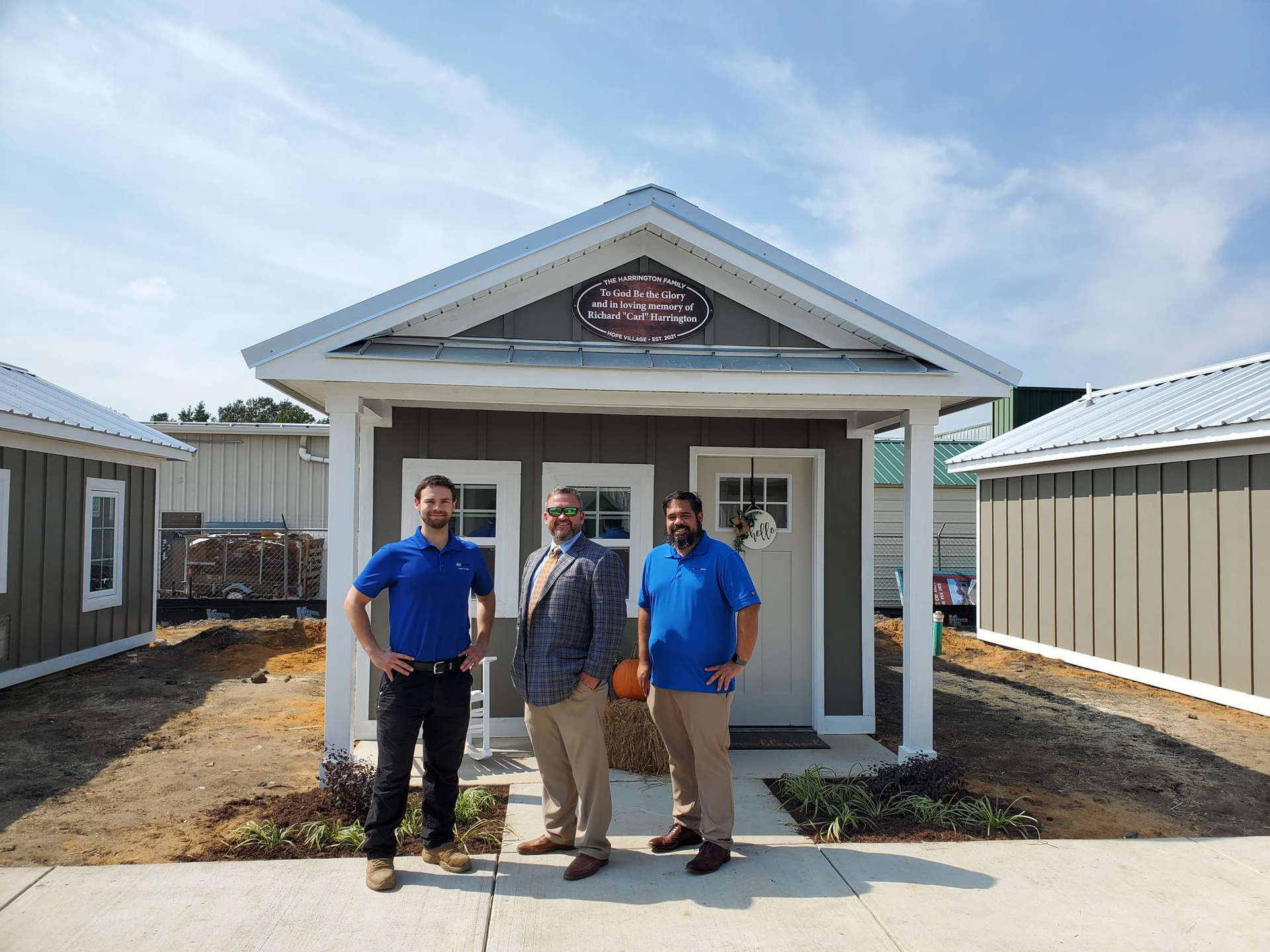 Nick Grady (left), fabrication product manager at A. O. Smith, Bryan Braddock (center), executive director at House of Hope and Denis Davis (right), communications director at House of Hope.