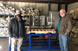 A TD technician and the camp chairman by the new interactive trainer. A TD technician and the camp chairman by the new interactive trainer.