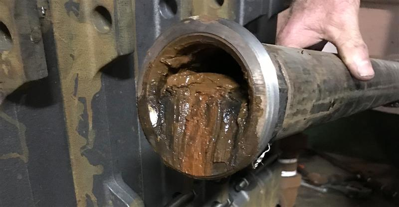 As you can see, this pipe is 75% full of sludge. The restriction slows the flow of water back to the boiler.