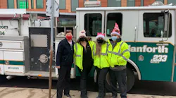 Members of the John W. Danforth team making a delivery to the Salvation Army in the company fire truck. Members of the John W. Danforth team making a delivery to the Salvation Army in the company fire truck.