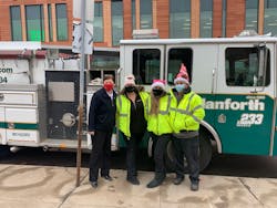 Members of the John W. Danforth team making a delivery to the Salvation Army in the company fire truck. Members of the John W. Danforth team making a delivery to the Salvation Army in the company fire truck.