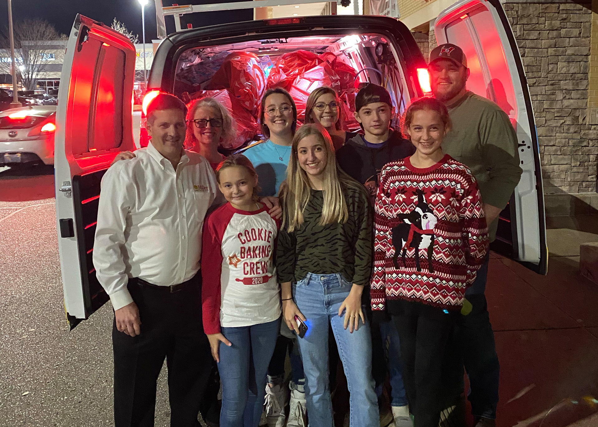 Founder and Chief Executive Officer Jimmy Hiller, his wife Michelle, their children, and their grandchildren delivering for Toys for Tots.