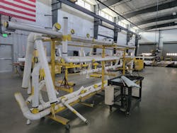 Olson Plumbing & Heating fabrication shop in Colorado Springs: “We felt Centennial would be a really good project for Uponor, given our own emphasis on prefabrication,” says project manager Lana Marsh. Using BIM, Olson can prefabricate 95 percent of the PVC piping installed underground, notes Olson BIM/CAD manager Chris Becker. “Prefabrication makes field installation go substantially faster, a critical necessity for meeting production schedules.” Shown here are 20-foot lengths of PVC, fitted with prefabricated connections, ready for shipment to the job site. Olson Plumbing & Heating fabrication shop in Colorado Springs: “We felt Centennial would be a really good project for Uponor, given our own emphasis on prefabrication,” says project manager Lana Marsh. Using BIM, Olson can prefabricate 95 percent of the PVC piping installed underground, notes Olson BIM/CAD manager Chris Becker. “Prefabrication makes field installation go substantially faster, a critical necessity for meeting production schedules.” Shown here are 20-foot lengths of PVC, fitted with prefabricated connections, ready for shipment to the job site.