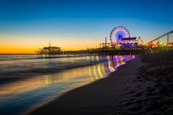 The Santa Monica Pier at sunset. The Santa Monica Pier at sunset.