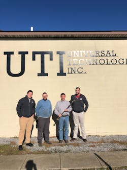 Harris employees Sam Koehne (far left) and Patrick Kelley (far right) with Jimmy Hogancamp and Teddy Cargill of Universal Technologies, Inc. Harris employees Sam Koehne (far left) and Patrick Kelley (far right) with Jimmy Hogancamp and Teddy Cargill of Universal Technologies, Inc.