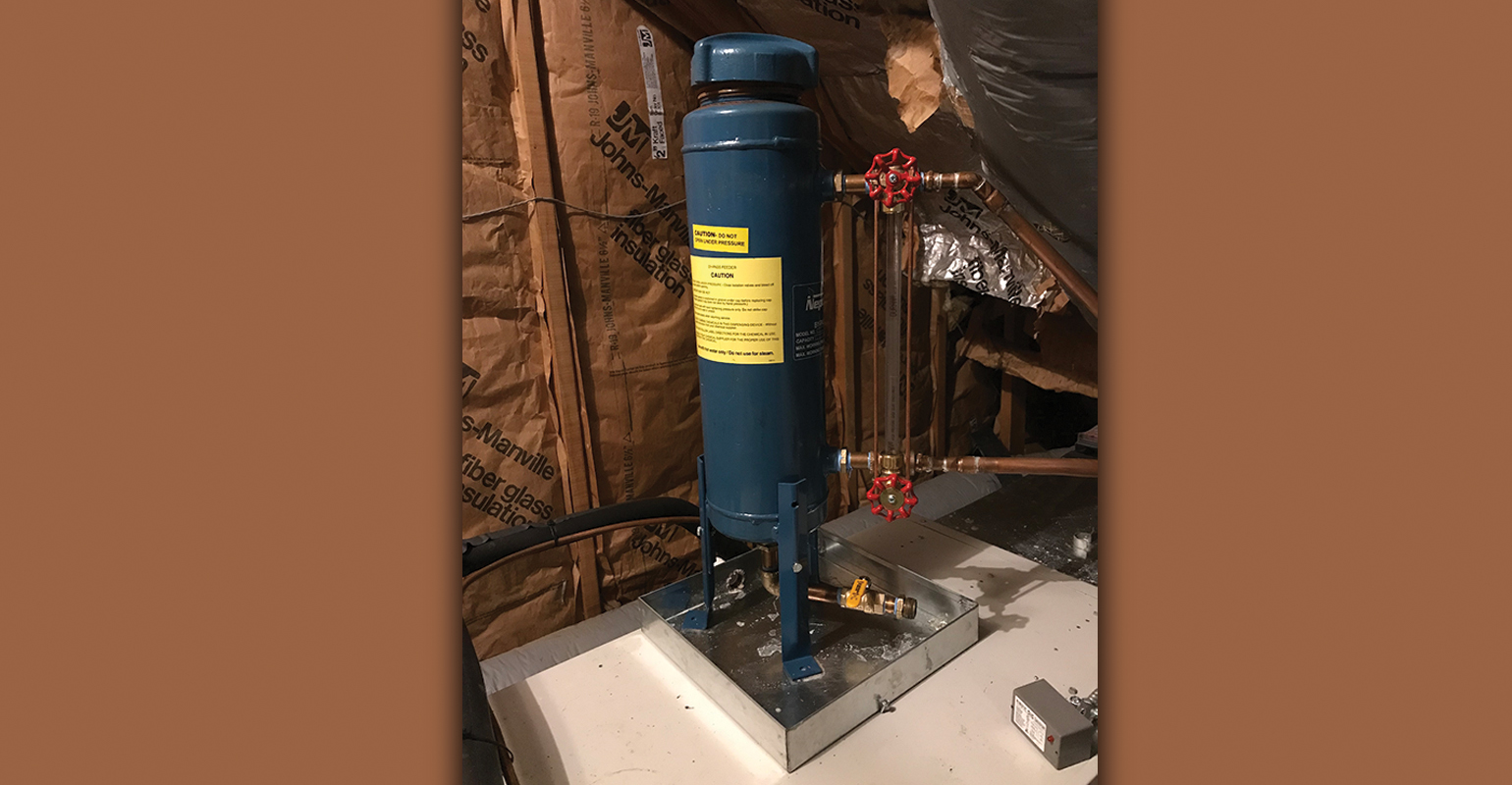 A chemical shot feeder expansion tank.