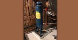 A chemical shot feeder expansion tank. A chemical shot feeder expansion tank.