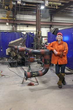 Lampe posing with a finished pipe assembly.