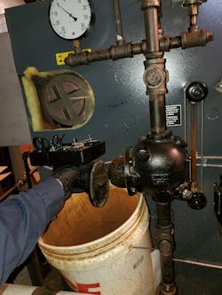 Photo #1 -- a controls side view of a commercial steam boiler with the float style low water cut-off taken apart. Photo #1 -- a controls side view of a commercial steam boiler with the float style low water cut-off taken apart.