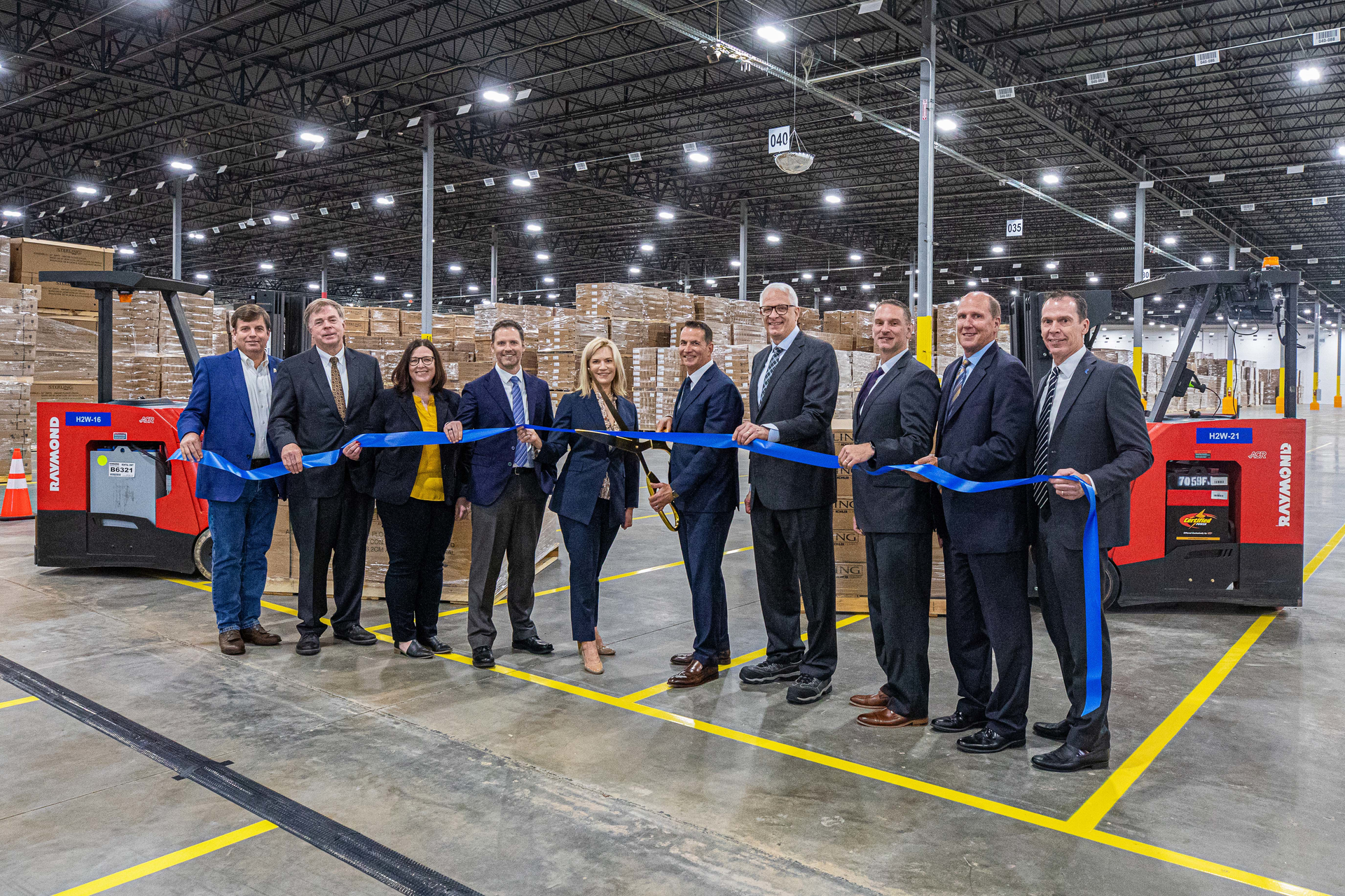 Kohler Co. CEO David Kohler (center) is shown cutting the ribbon, and was joined by (left to right) Dale Strong, Chairman-Madison County Commission; Tommy Battle, Mayor- Huntsville; Ginger King, VP, HR-Kohler Kitchen & Bath; Norb Schmidt, SVP-Kohler Kitchen & Bath Operations; Laura Kohler, SVP-Kohler Co. HR, Stewardship & Sustainability; David Kohler; Tom Adler, CFO-Kohler Co.; Shawn Oldenhoff, President-Kohler Kitchen & Bath North America; Paul Finley, Mayor-Madison; and Mike Fenske, President & GM-Global Facilities, Burns & McDonnell.