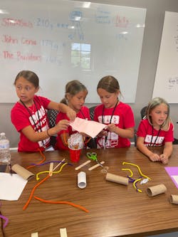 A student team working to build a flashlight during 'We Love STEM Day.' A student team working to build a flashlight during 'We Love STEM Day.'