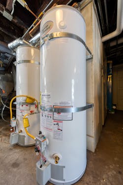 Due to the tight footprint of the mechanical room, Excalibur Water Heaters installed two 50-gallon tanks instead of one 100-gallon tank. Due to the tight footprint of the mechanical room, Excalibur Water Heaters installed two 50-gallon tanks instead of one 100-gallon tank.