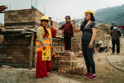 New homeowner Sabita T. taking a break on her job site with NIVAS Program Coordinator in Nuwakot, Nepal. New homeowner Sabita T. taking a break on her job site with NIVAS Program Coordinator in Nuwakot, Nepal.