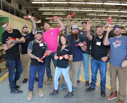 Experience Trip winners at the end of the factory tour, each holding their customized wrenches. Experience Trip winners at the end of the factory tour, each holding their customized wrenches.