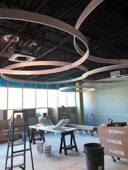 During construction, Pattman had to be very careful to lay out the ceiling cassettes to land perfectly within the drop ceiling “clouds.” During construction, Pattman had to be very careful to lay out the ceiling cassettes to land perfectly within the drop ceiling “clouds.”