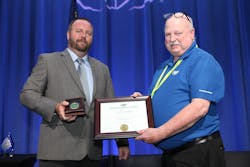 Tim Collings, retired senior building inspector, city of Salt Lake, receives the President's Green Oval Awards at the 93rd annual Education and Business Conference. Tim Collings, retired senior building inspector, city of Salt Lake, receives the President's Green Oval Awards at the 93rd annual Education and Business Conference.