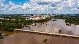 Jackson, MS Skyline with flooding Pearl River in the foreground in August 2022.