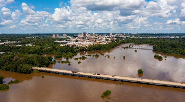 Jackson, MS Skyline with flooding Pearl River in the foreground in August 2022.