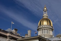 Gold dome of the New Jersey State Capitol Building in Trenton on a beautiful spring day. Gold dome of the New Jersey State Capitol Building in Trenton on a beautiful spring day.