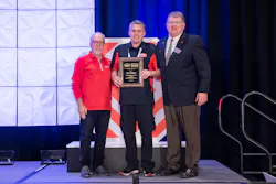 Paul Hallam (center) receives his award. Paul Hallam (center) receives his award.