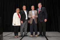 Chip Greene (holding award) and PHCC&mdash;National President Joel Long (far right).