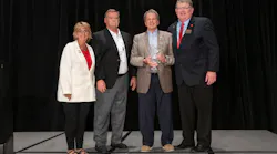 Chip Greene (holding award) and PHCC—National President Joel Long (far right).