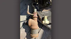 The red fitting on top of the very large tee is a Bell & Gossett dip tube air separator.