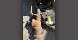 The red fitting on top of the very large tee is a Bell & Gossett dip tube air separator. The red fitting on top of the very large tee is a Bell & Gossett dip tube air separator.