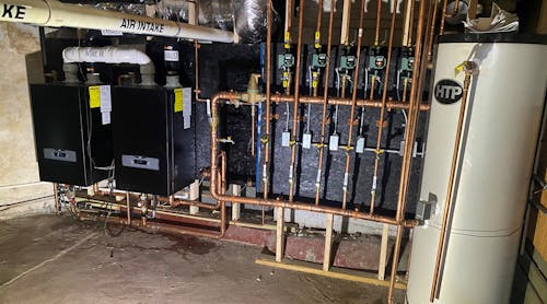 The mechanical room a the Massachusetts home with HTP boilers and storage tank, and Taco circulators.