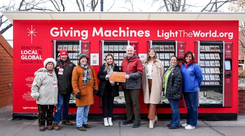 Giving Machines volunteers and representatives from Habitat for Humanity, Doctors Care and A Precious Child join Applewood Plumbing Heating &amp; Electric to receive donation to Denver&rsquo;s Giving Machines.