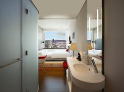 A modular bathroom with a view at the citizenM Bowery Hotel. A modular bathroom with a view at the citizenM Bowery Hotel.