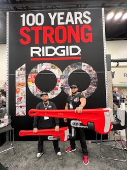 Posing with oversized novelty wrenches at the RIDGID booth at the WWETT Show.