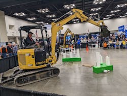 Competitors in the backhoe ROE-D-HOE show off their precision skills at the WWETT Show.