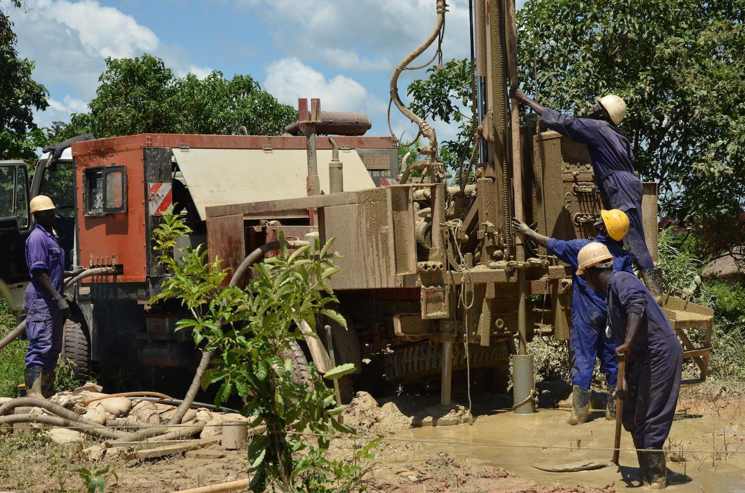 A well building team used a truck-mounted drill rig made by Atlas Corp.