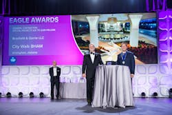 At the 2023 Eagle Awards, National Chair of the ABC Board of Directors Milton Graugnard (center) presents an award to Kyle McMullen of Brasfield and Gorrie while ABC Business Development Committee Chair Michael Barker (left) looks on. At the 2023 Eagle Awards, National Chair of the ABC Board of Directors Milton Graugnard (center) presents an award to Kyle McMullen of Brasfield and Gorrie while ABC Business Development Committee Chair Michael Barker (left) looks on.